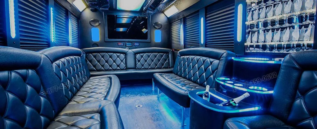 Party bus interior with bar, wine glasses and blue LED lighting
