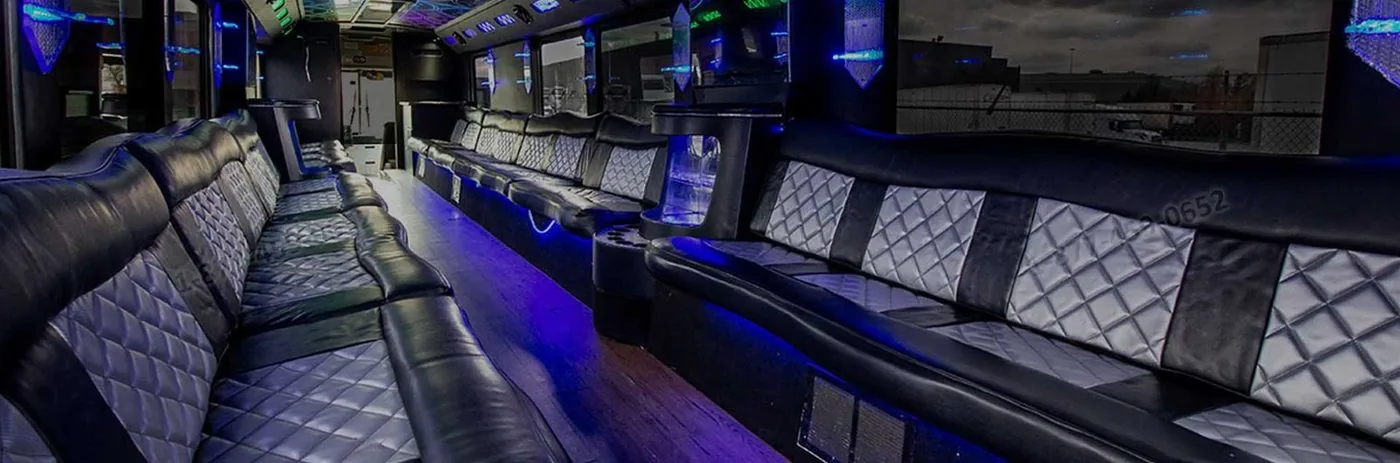 Luxury party bus interior with quilted leather seating and LED lighting